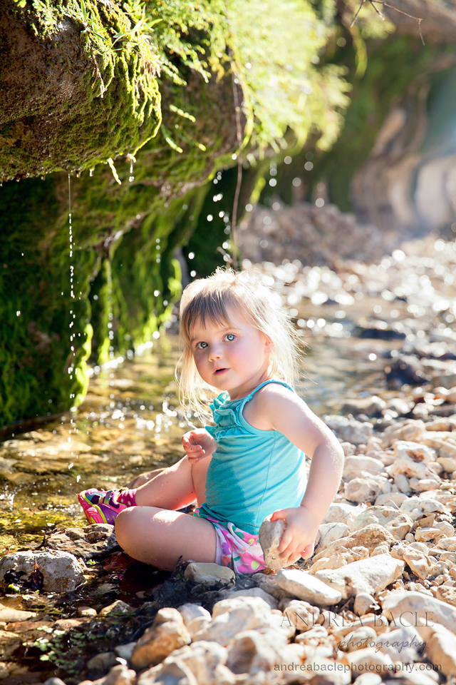 two year old girl in the creek new braunfels destination photographer