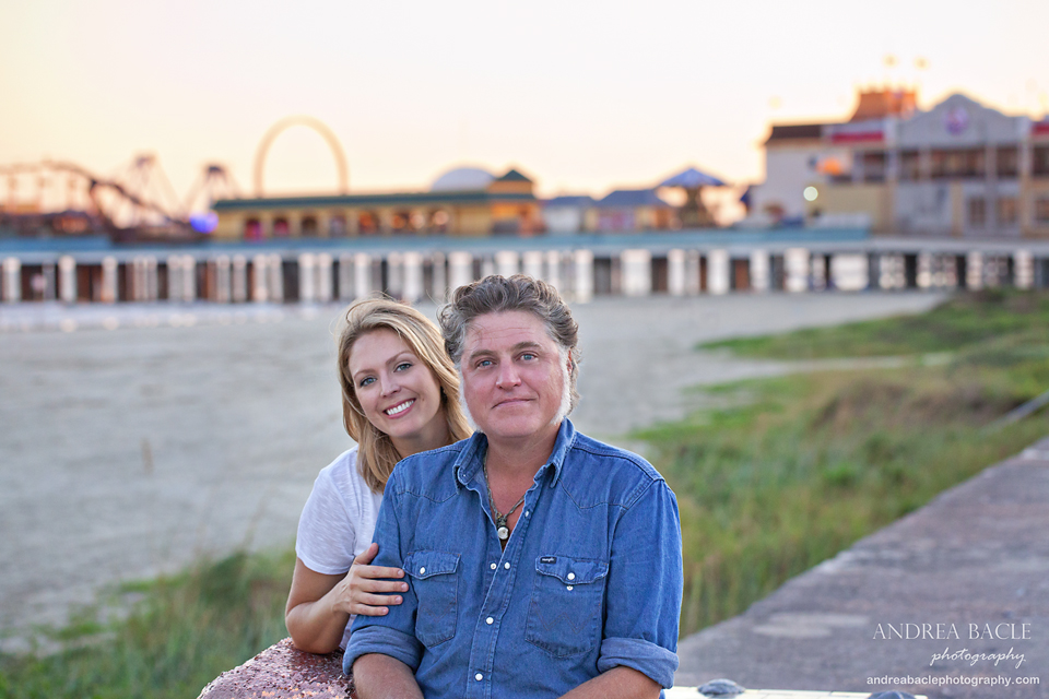 galveston beach couple in love in front of pleasure pier